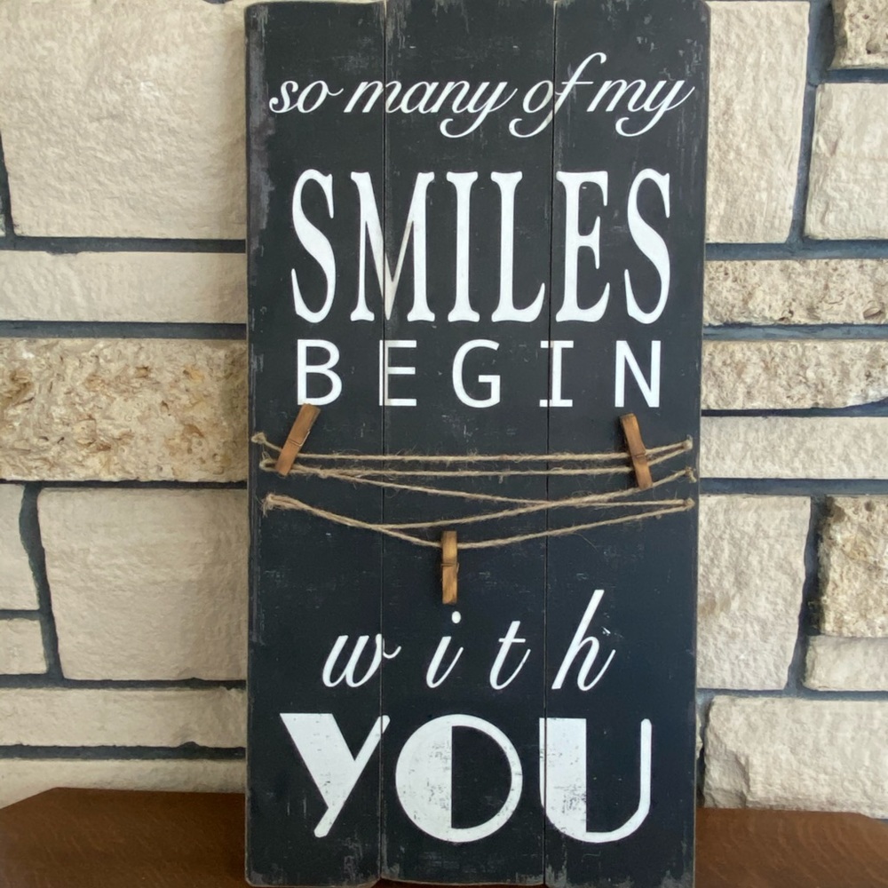 SMILES sign with photo clips